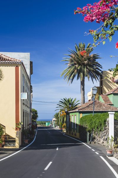 Main street and houses with deep blue sky in San Andres village in the east of La Palma, Spain.